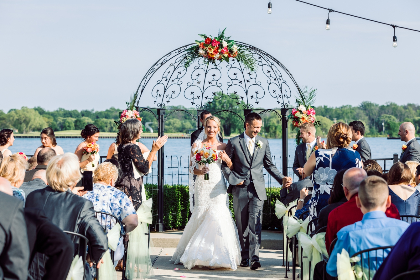 Bride and groom at the altar right after they are pronounced husband and wife at the Roostertail in Detroit Michigan