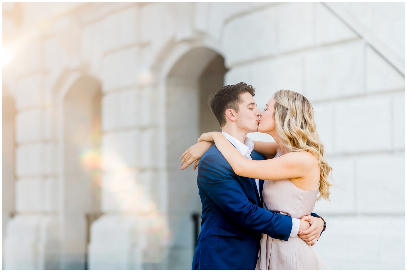 man and woman kissing during engagement photos at the Detroit Institute of Arts in Detroit Michigan