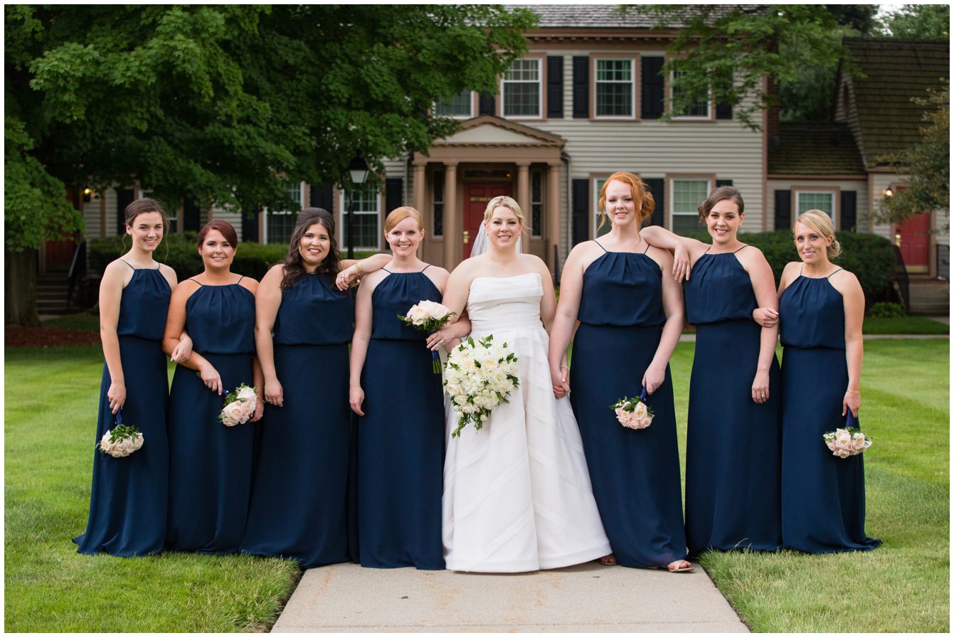 Bridesmaids with beautiful florals from Silk Thumb Florist at the Dearborn Inn