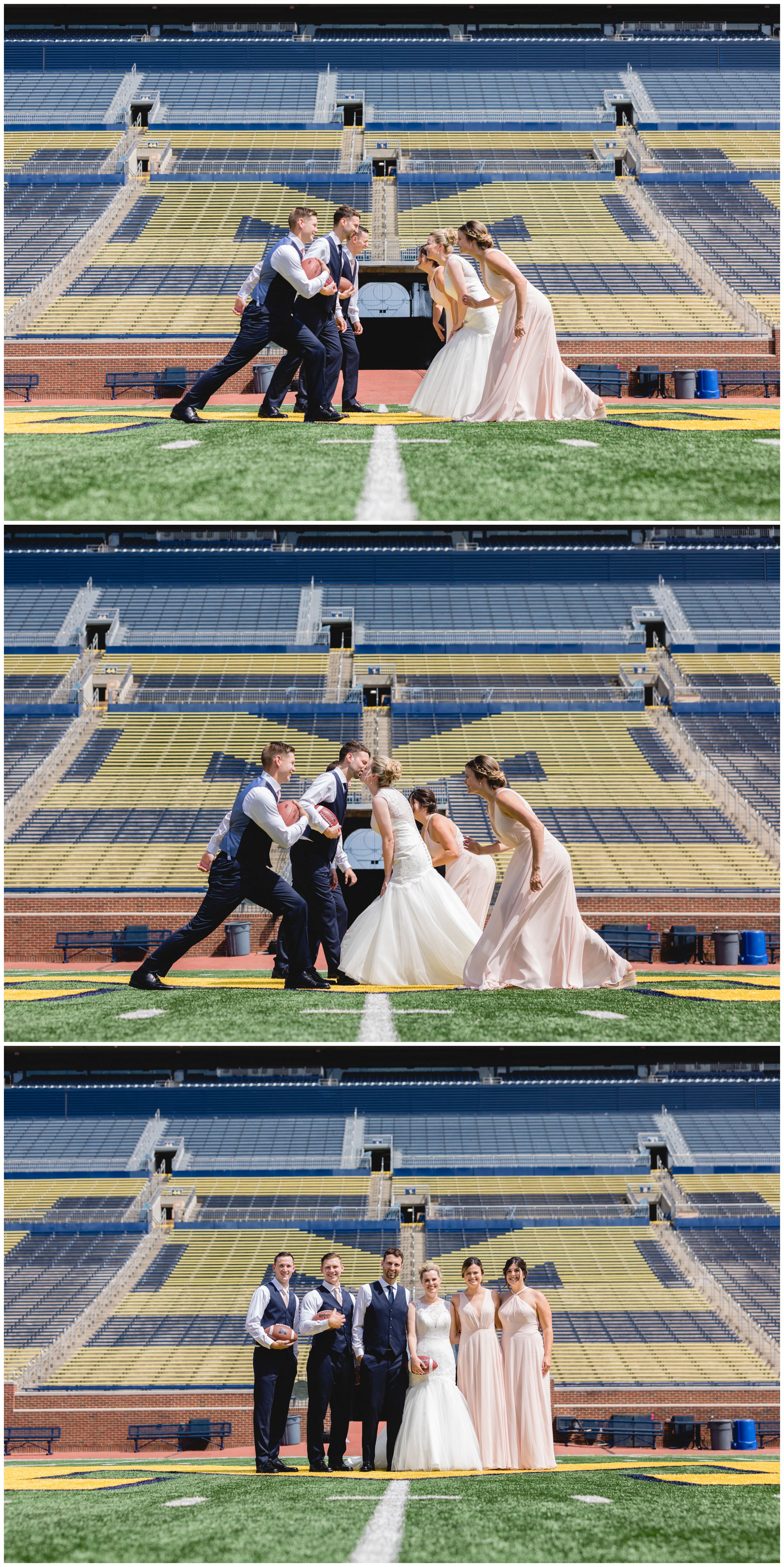 Bride and groom and the entire wedding party on the field at the Big House at the University of Michigan