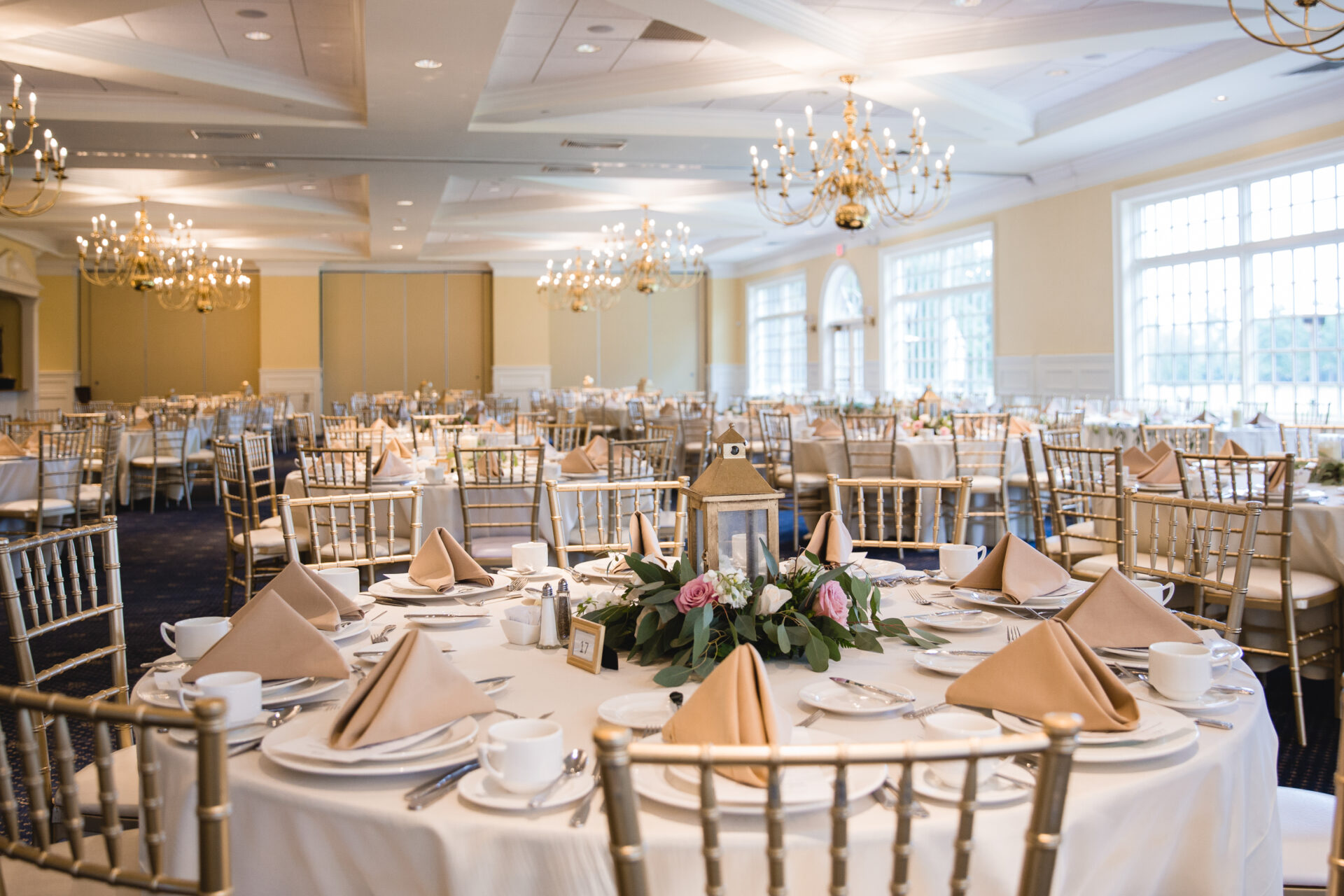 Reception decor and golden fall light inside Cherry Creek’s ballroom