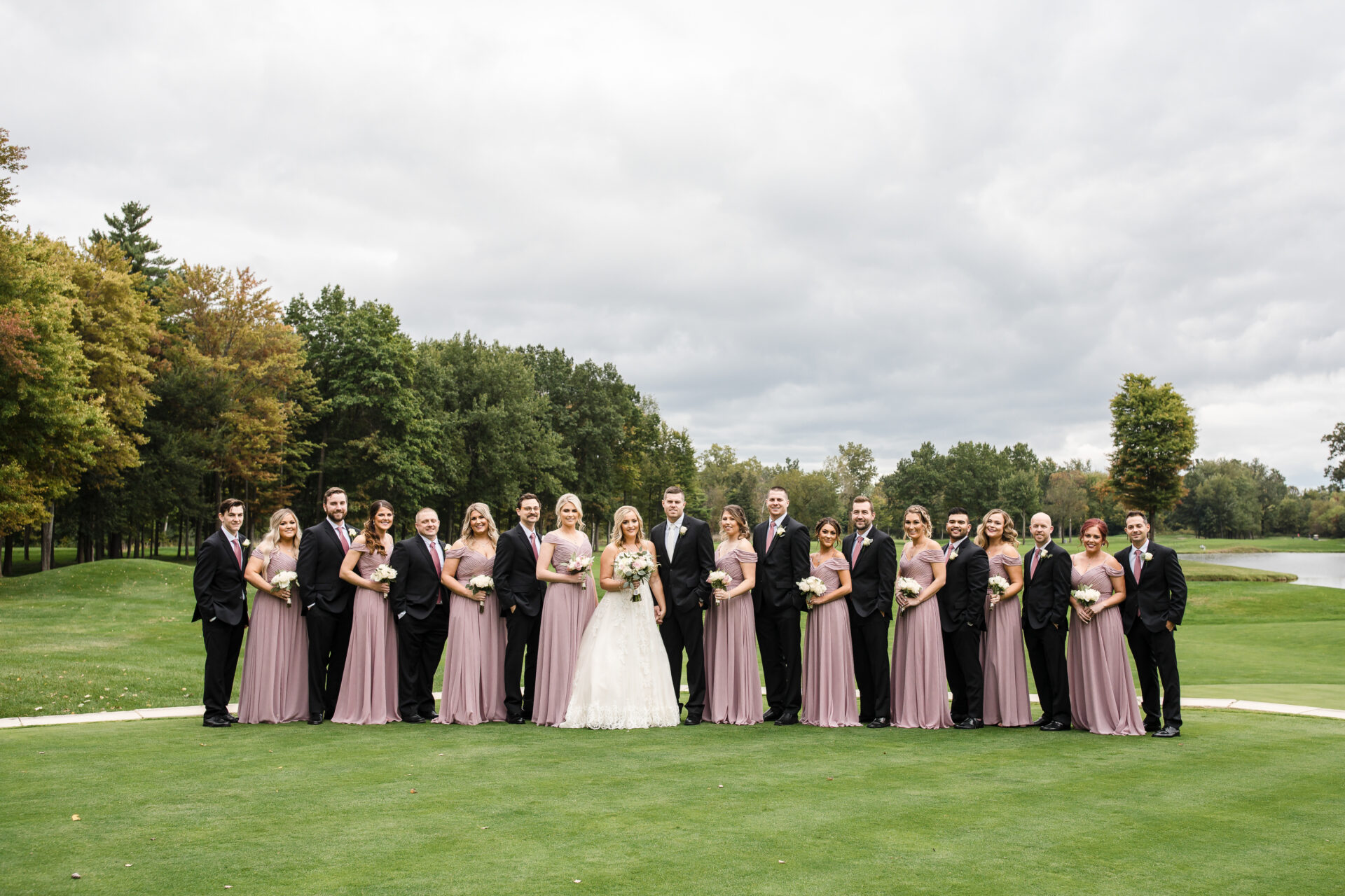 wedding party with lovely lilac colored dresses on the golf course at Cherry Creek