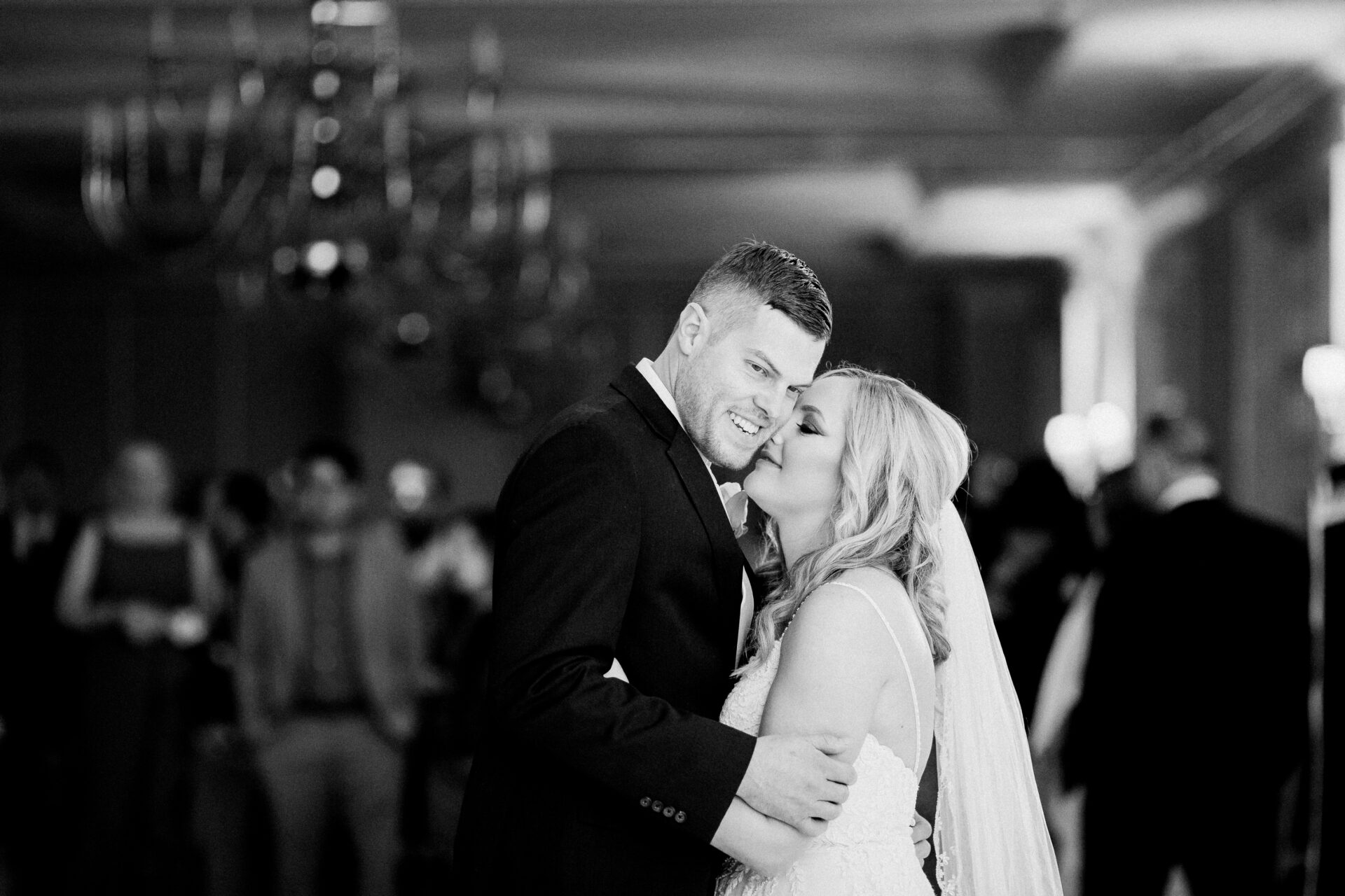 Couple’s first dance at Cherry Creek Golf Club surrounded by friends and family
