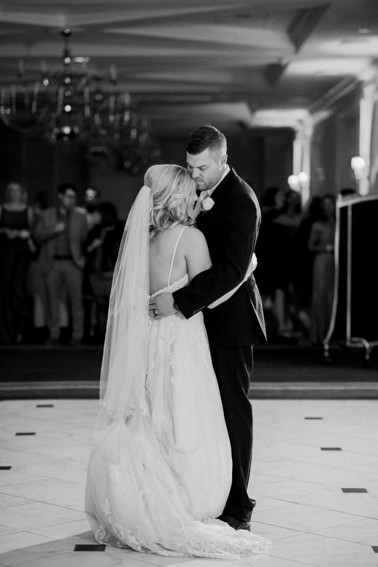 Couple’s first dance at Cherry Creek Golf Club surrounded by friends and family