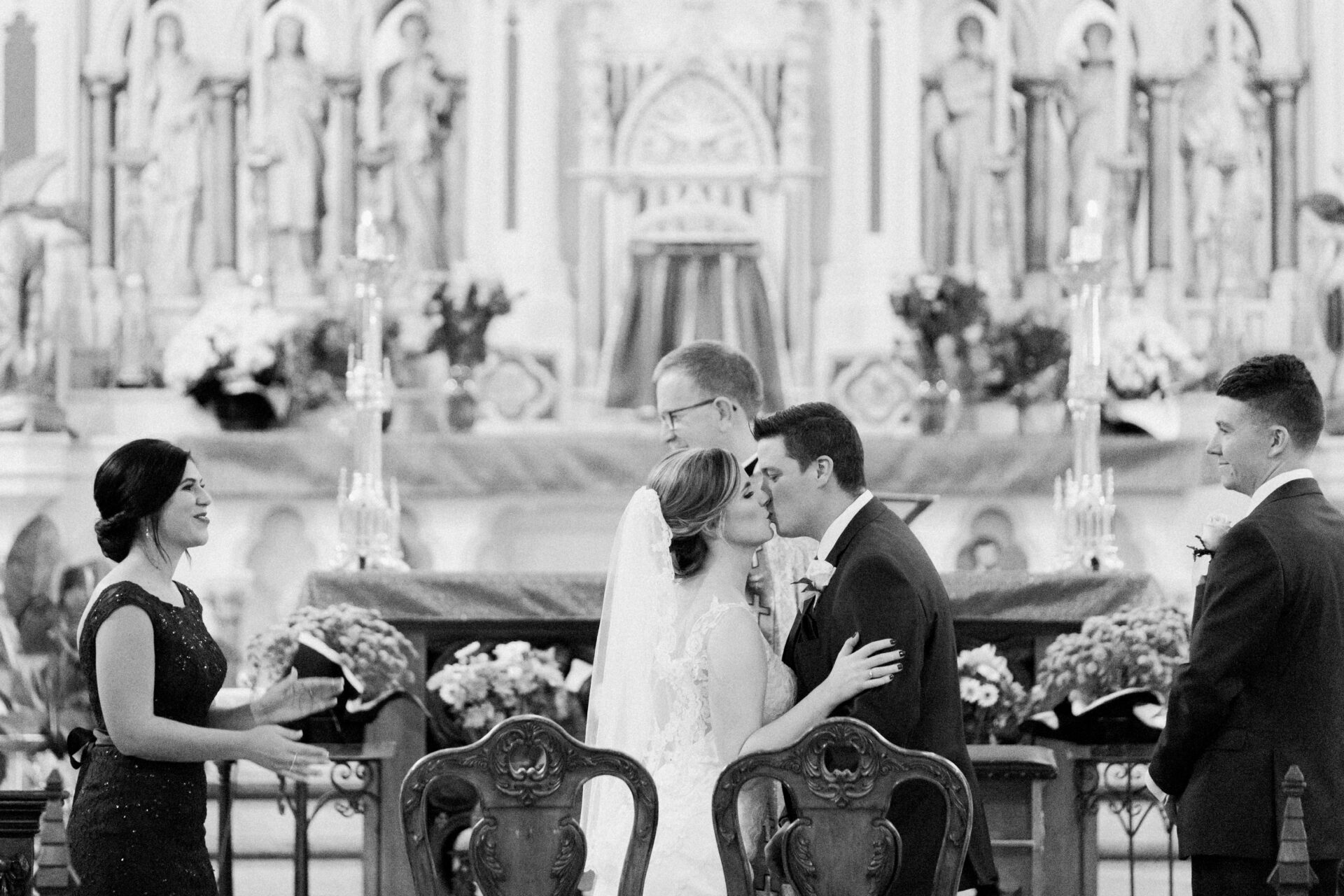 first kiss at a fall wedding Ste. Anne de Detroit by Michele Maloney Photography
