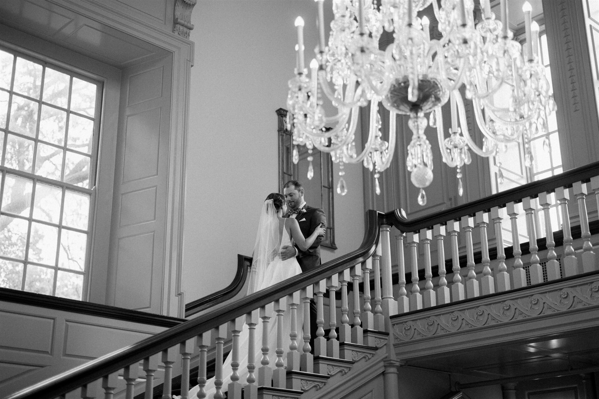 Anne and Brian posing for wedding portraits inside the Lovett Hall.