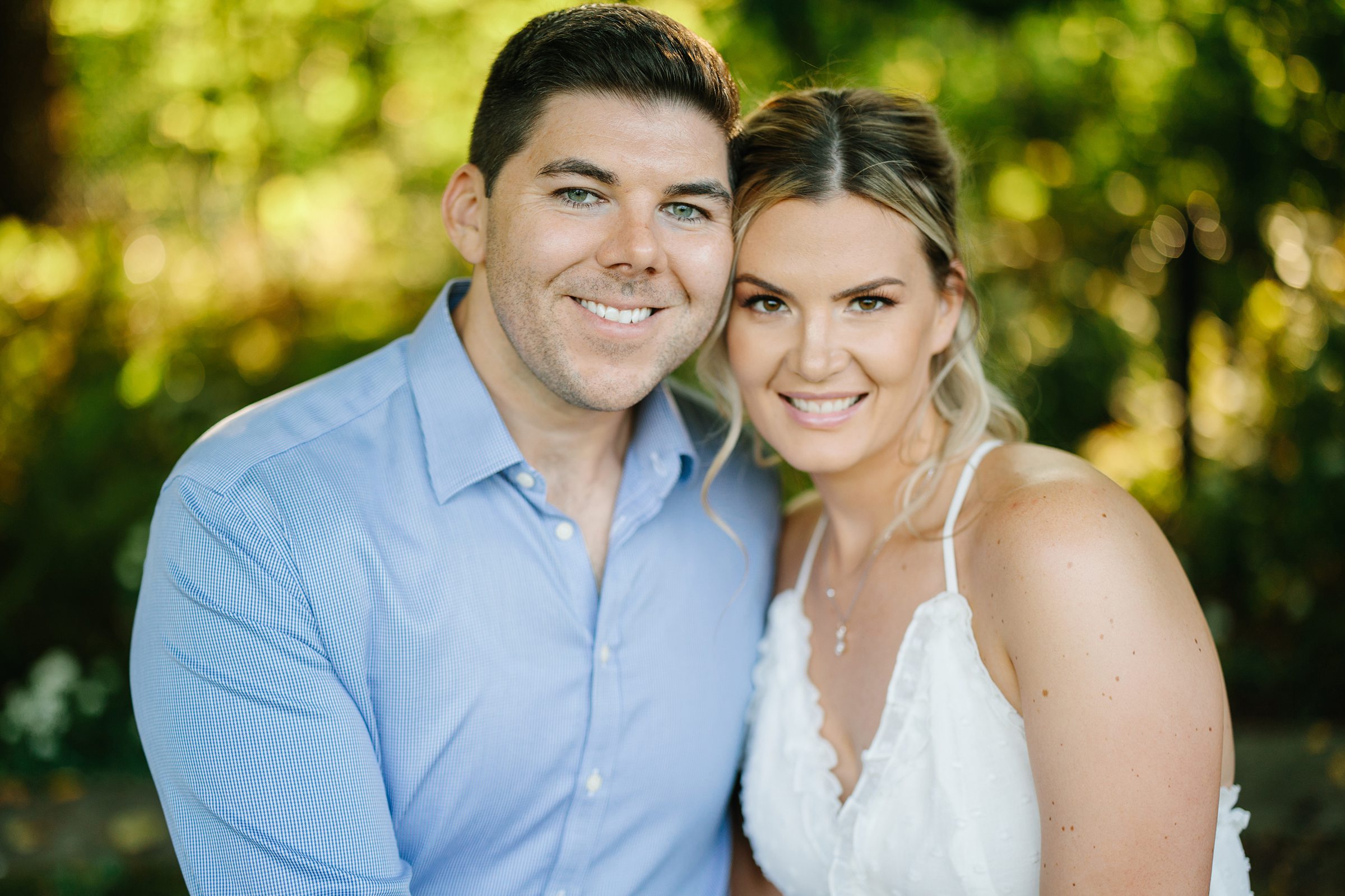 Close up shot of engaged couple smiling for a portrait at their Henry Ford Fair Lane Engagement Session by Detroit Wedding Photographer Michele Maloney