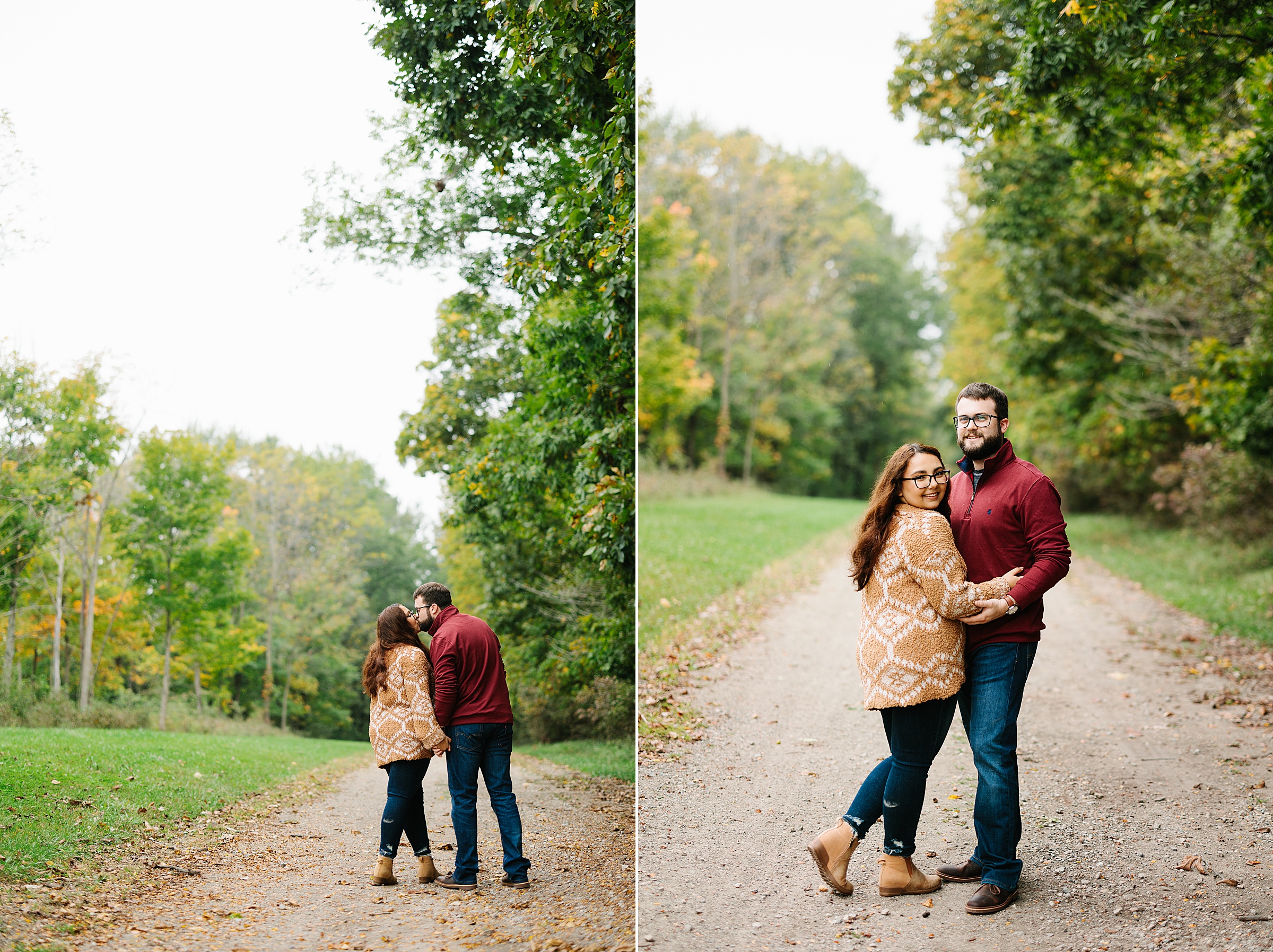 Engaged couple stands on a path in the woods and kisses; engaged couple stands on a path and smiles at the camera for a fall engagement session by Detroit Wedding Photographer Michele Maloney 