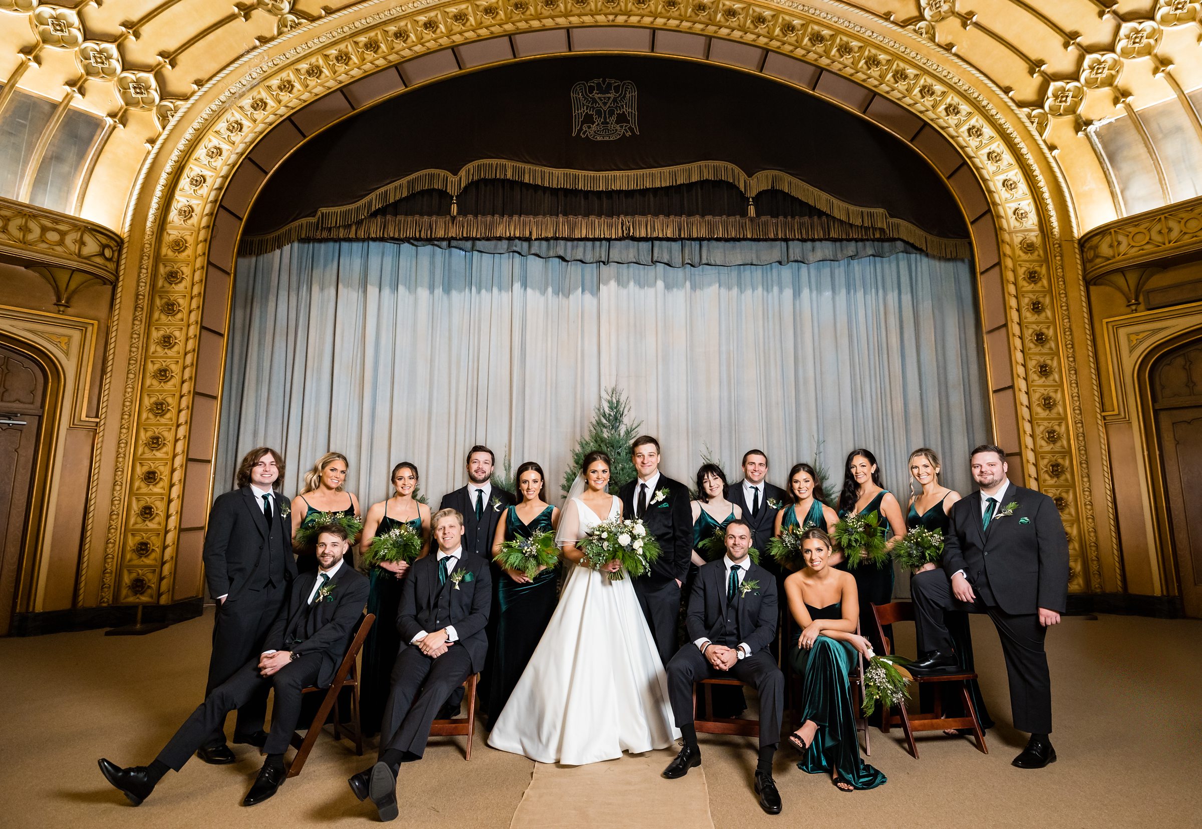 Bridal party poses for pictures after the ceremony by Detroit Wedding Photographer Michele Maloney