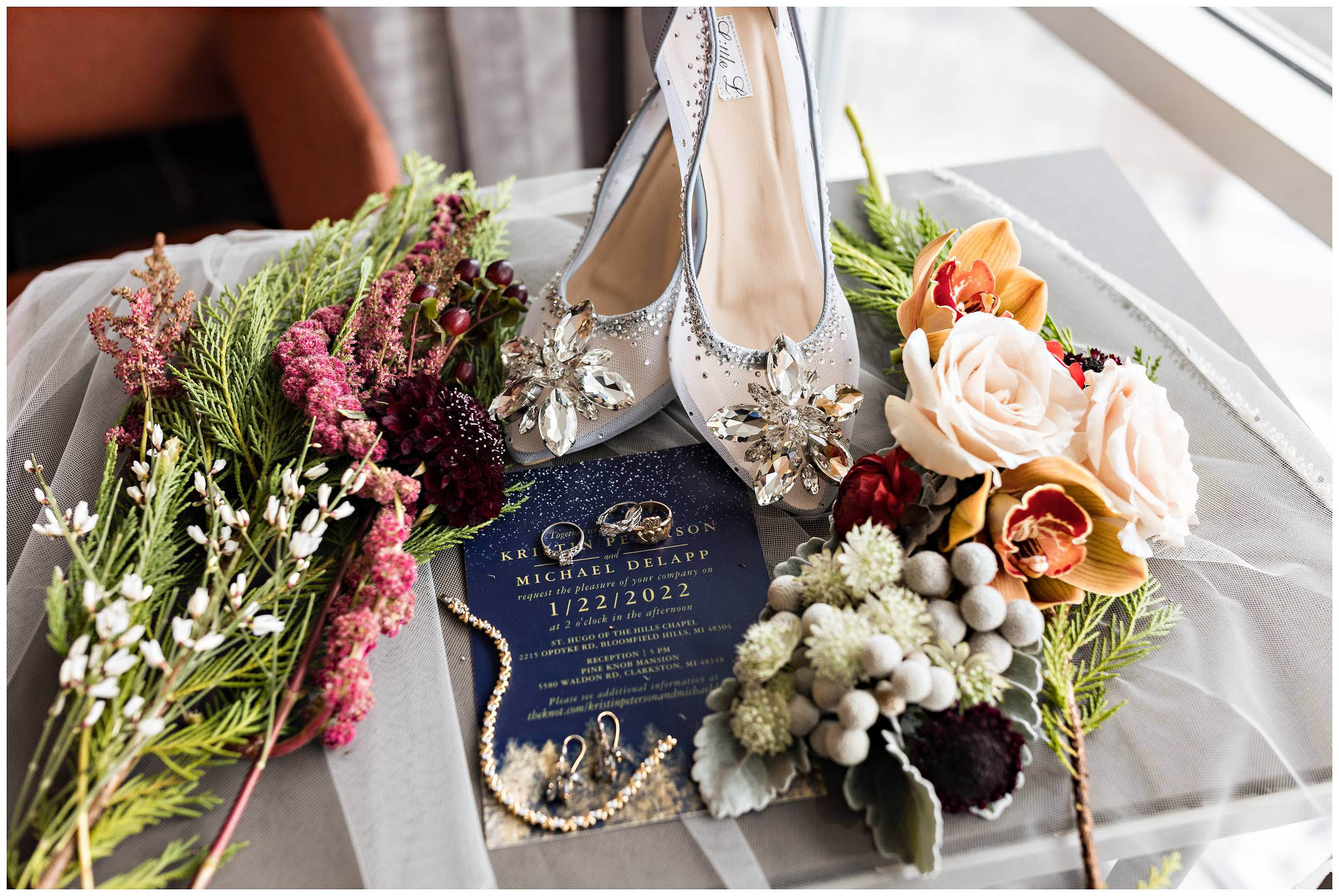 Detailed shot of bridal shoes, wedding invite, bouquet, rings, and jewelry by Detroit Wedding Photographer Michele Maloney 