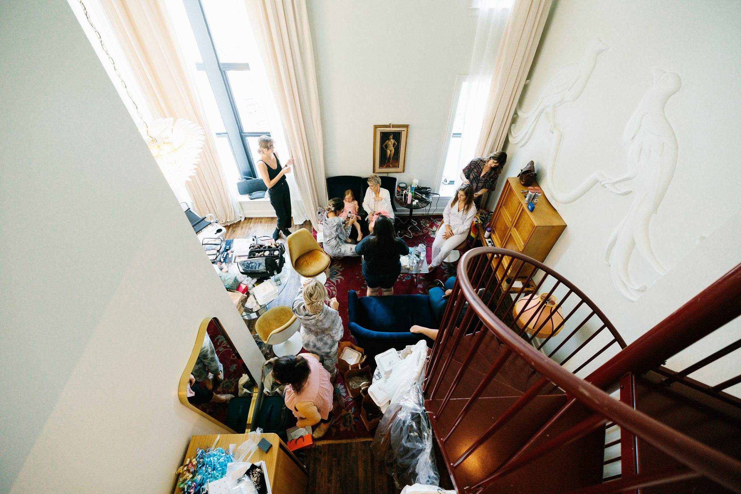 View of the bride and bridesmaids getting ready at the Siren Hotel by Detroit Wedding Photographer Michele Maloney