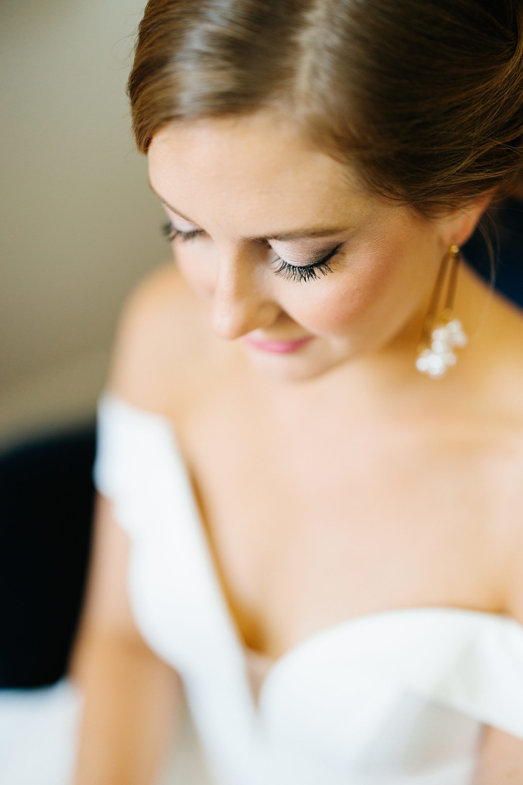 Close up shot of the bride ready and waiting before the first look, the bride is looking downwards by Detroit Wedding Photographer Michele Maloney 
