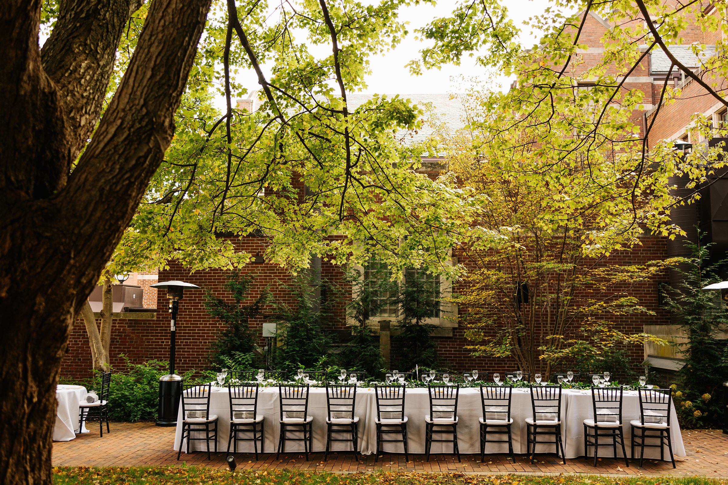 Long table setting outside the Inn at the Michigan League wedding by Detroit Wedding Photographer Michele Maloney