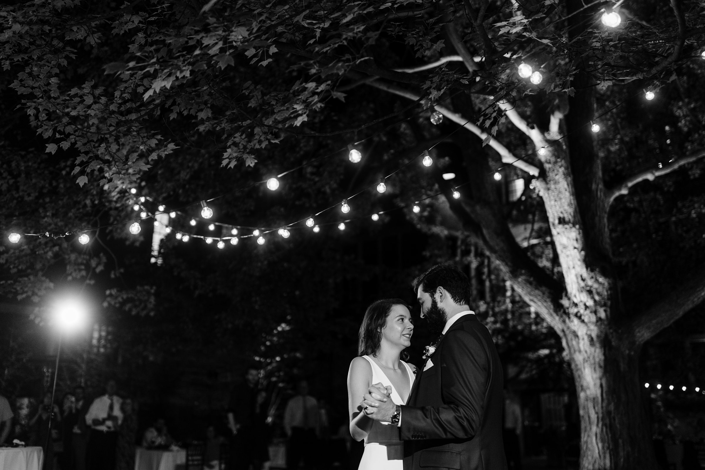 Black and white shot of the bride and groom slow dancing during The Inn at the Michigan League Wedding reception by Detroit Wedding Photographer Michele Maloney