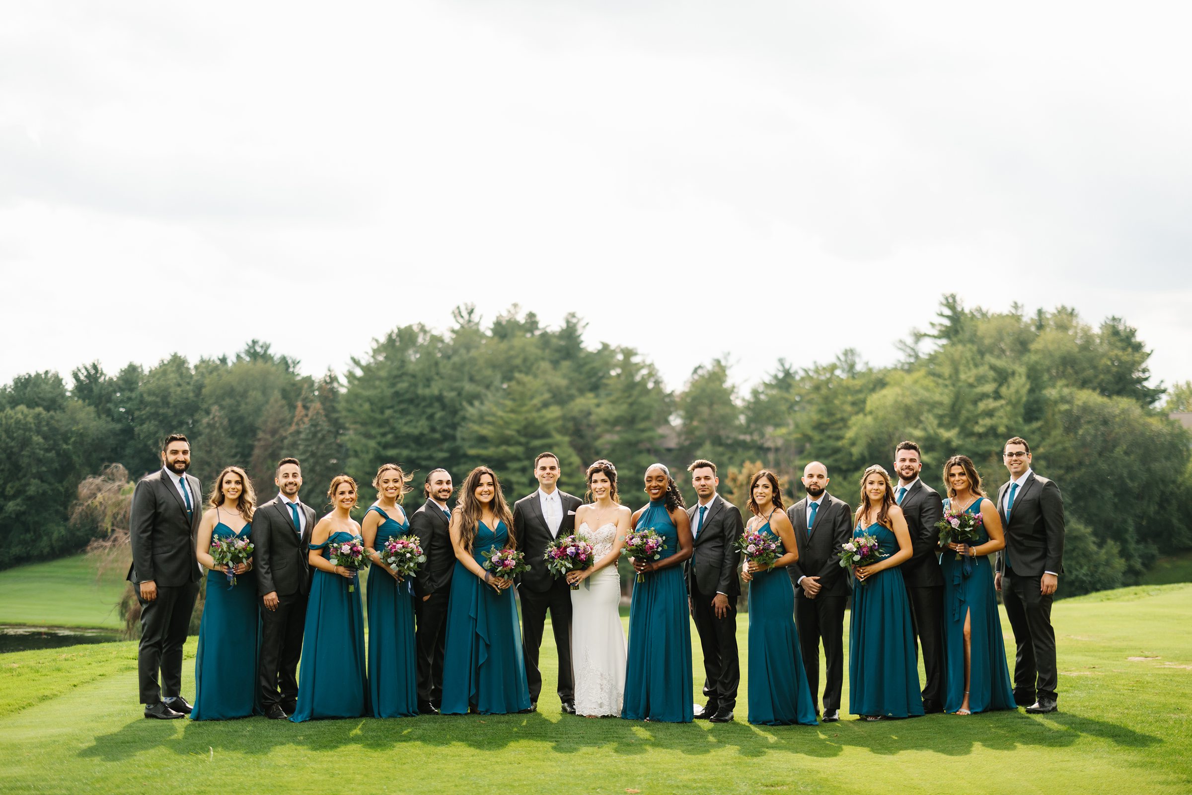 Formal shot of the bridal party outside Wabeek Country Club by Detroit Wedding Photographer Michele Maloney