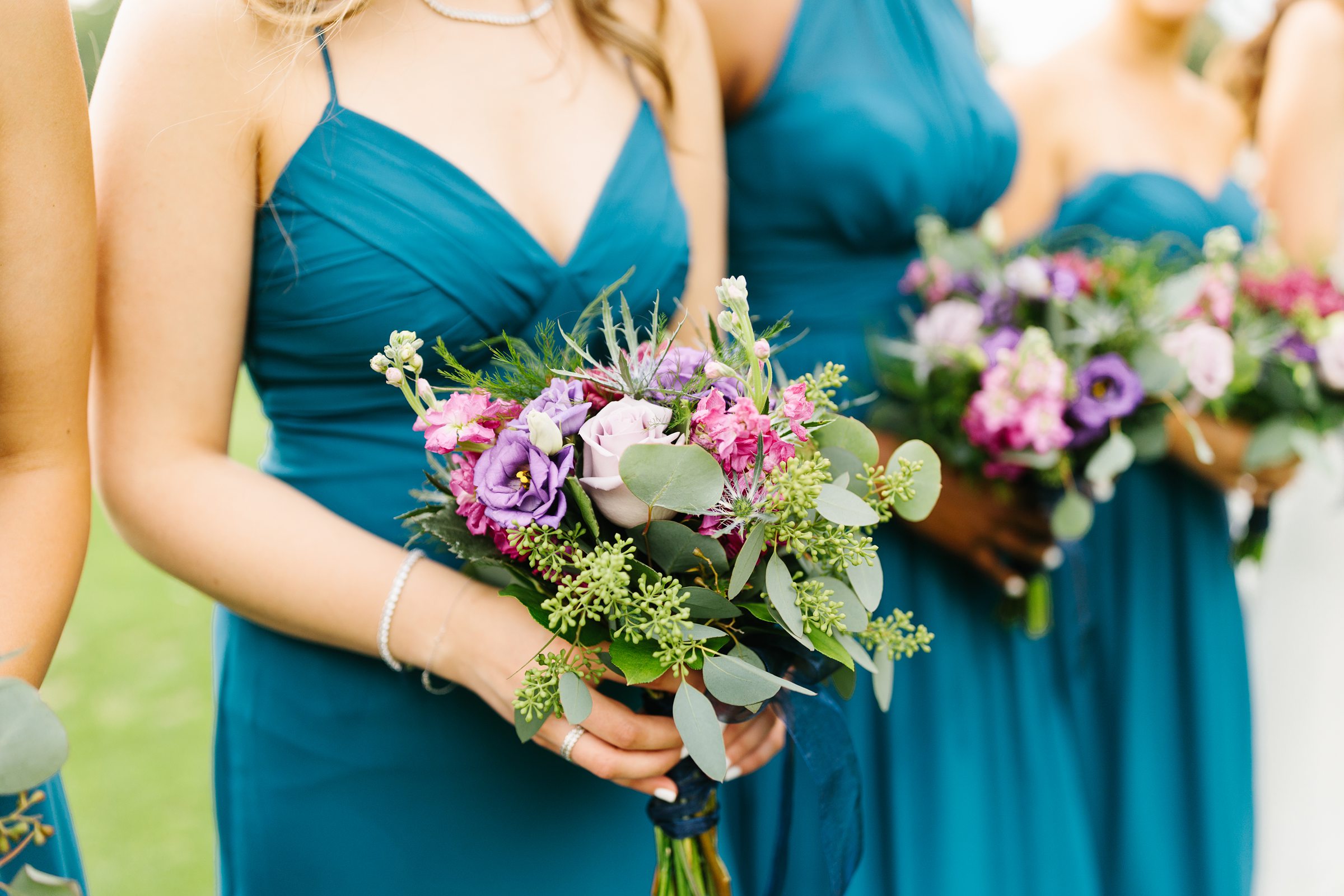 Close up picture of the bridesmaid's flower bouquets by Detroit Wedding Photographer Michele Maloney