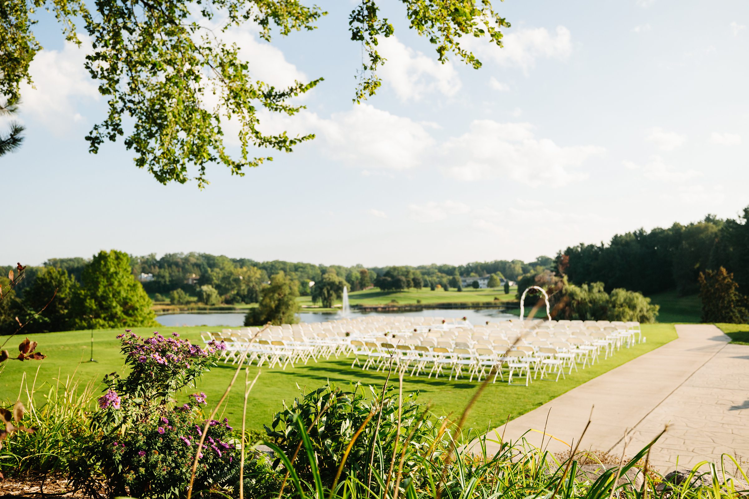 Faraway shot of the ceremony before anyone arrives at Wabeek Country Club by Detroit Wedding Photographer Michele Maloney