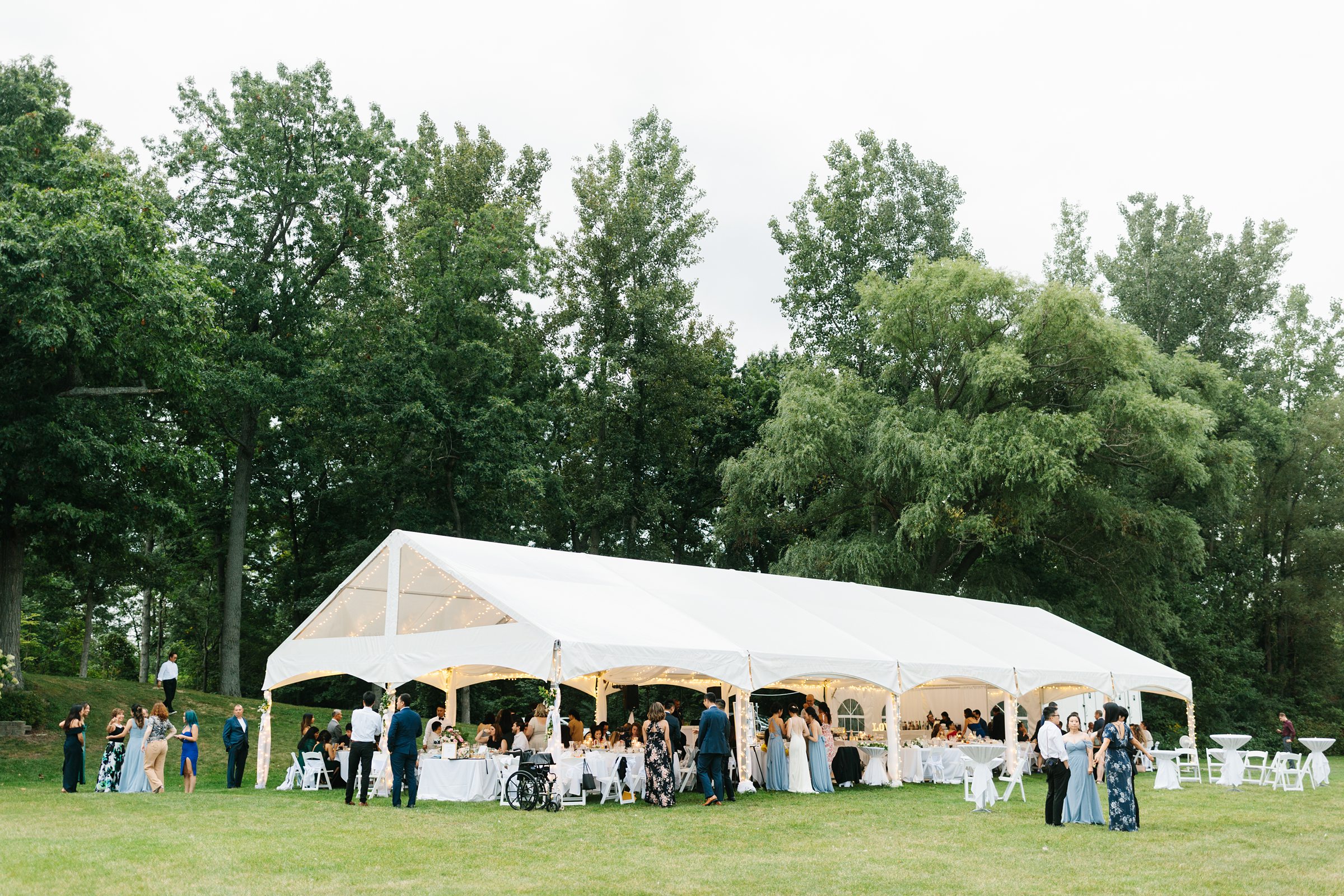 Faraway shot of the outdoor wedding reception for the Waldenwoods Summer Wedding by Detroit Wedding Photographer Michele Maloney