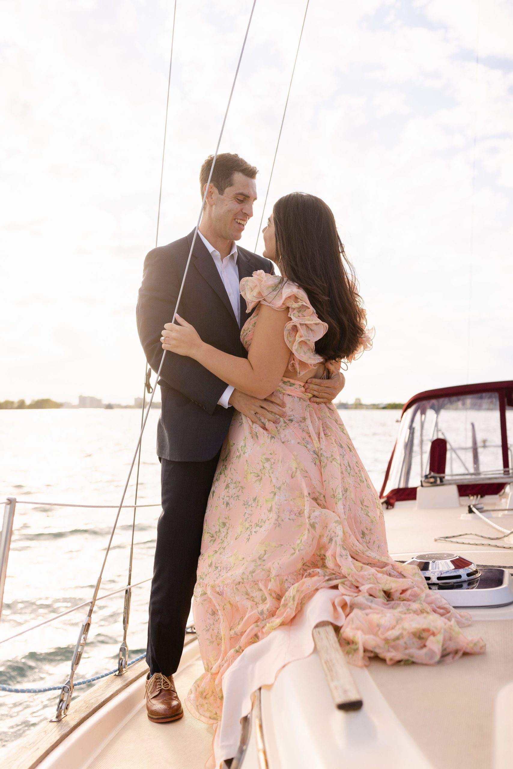 Couple on an Engagement Session on a sailboat in Michigan by Michele Maloney Photography