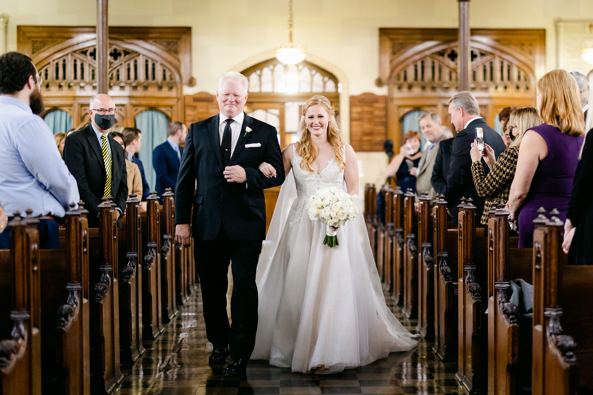 Dad walking bride down the aisle at Marysgrove Catholic Church in Detroit Michigan by Michele Maloney Photography