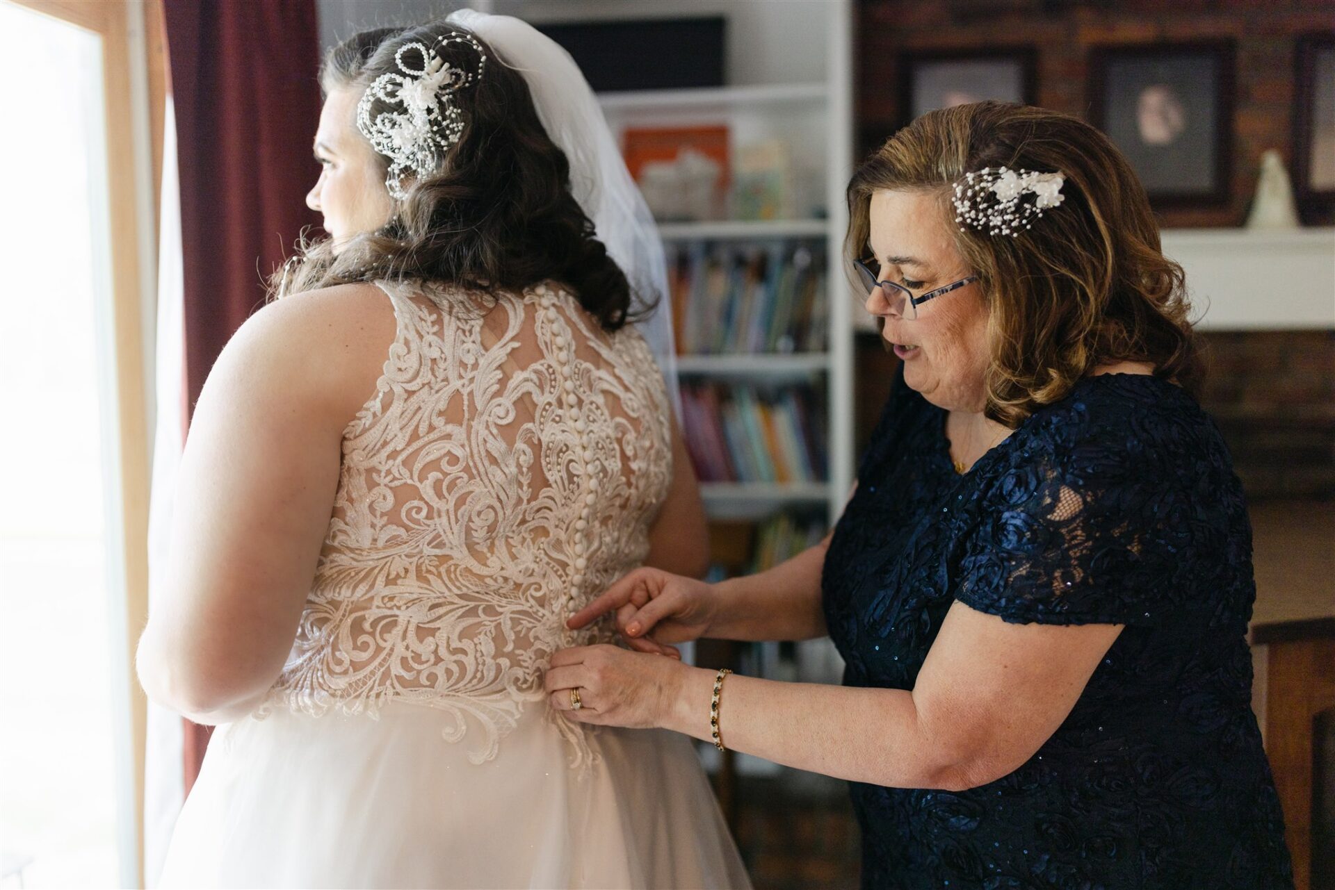 Bride wearing hairpiece made from her mom’s wedding crown during spring Plymouth wedding
