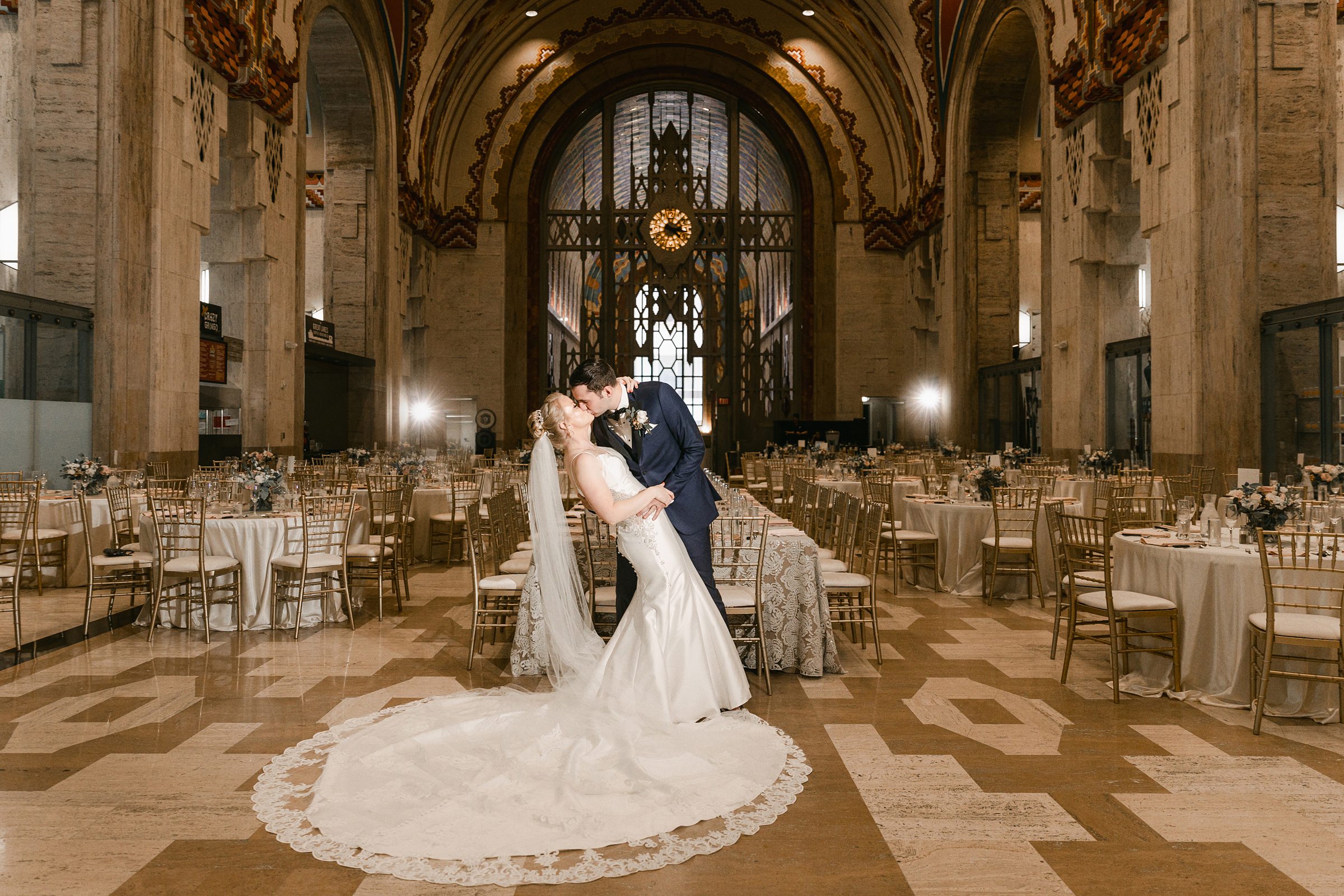 The bride and groom kissing in the Guardian Building in Detroit by Michele Maloney Photography