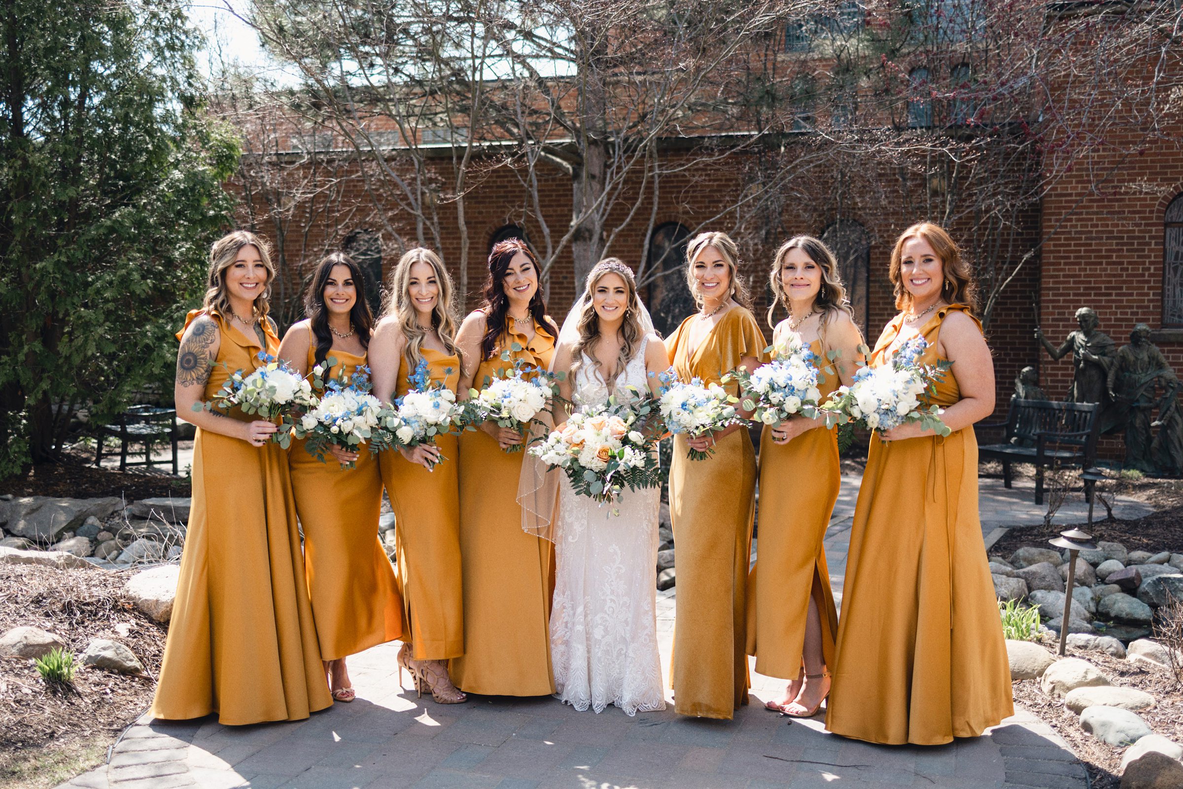 Bride and her bridesmaids in the courtyard at Saint John's Resort by Michele Maloney Photography