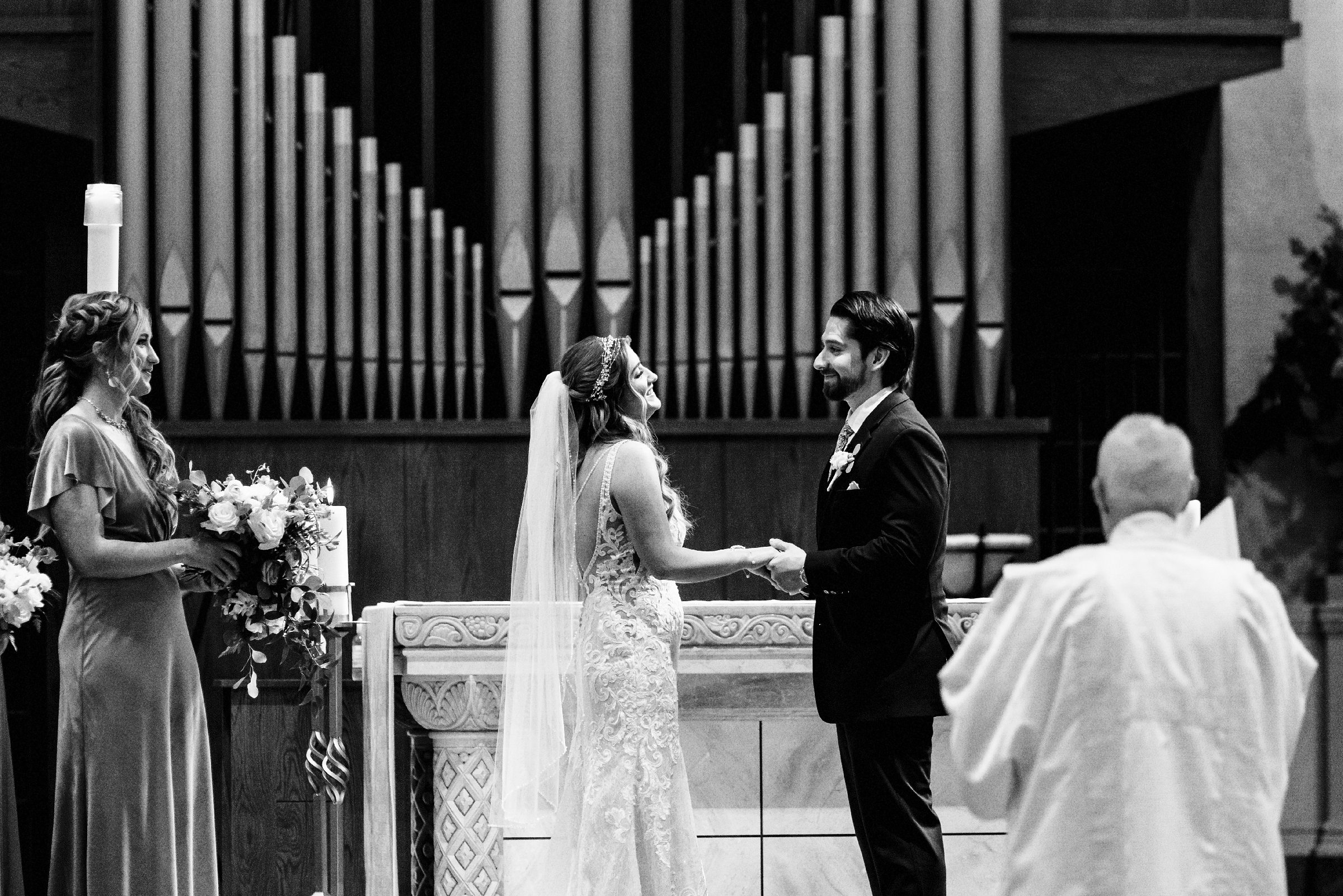 Ring exchange in the chapel at Saint John's Resort by Michele Maloney Photography