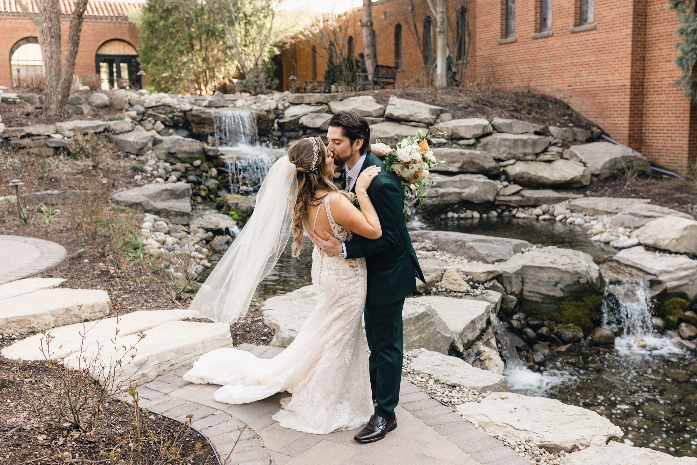 Bride and Groom Kissing in the courtyard at Saint John's Resort by Michele Maloney Photography