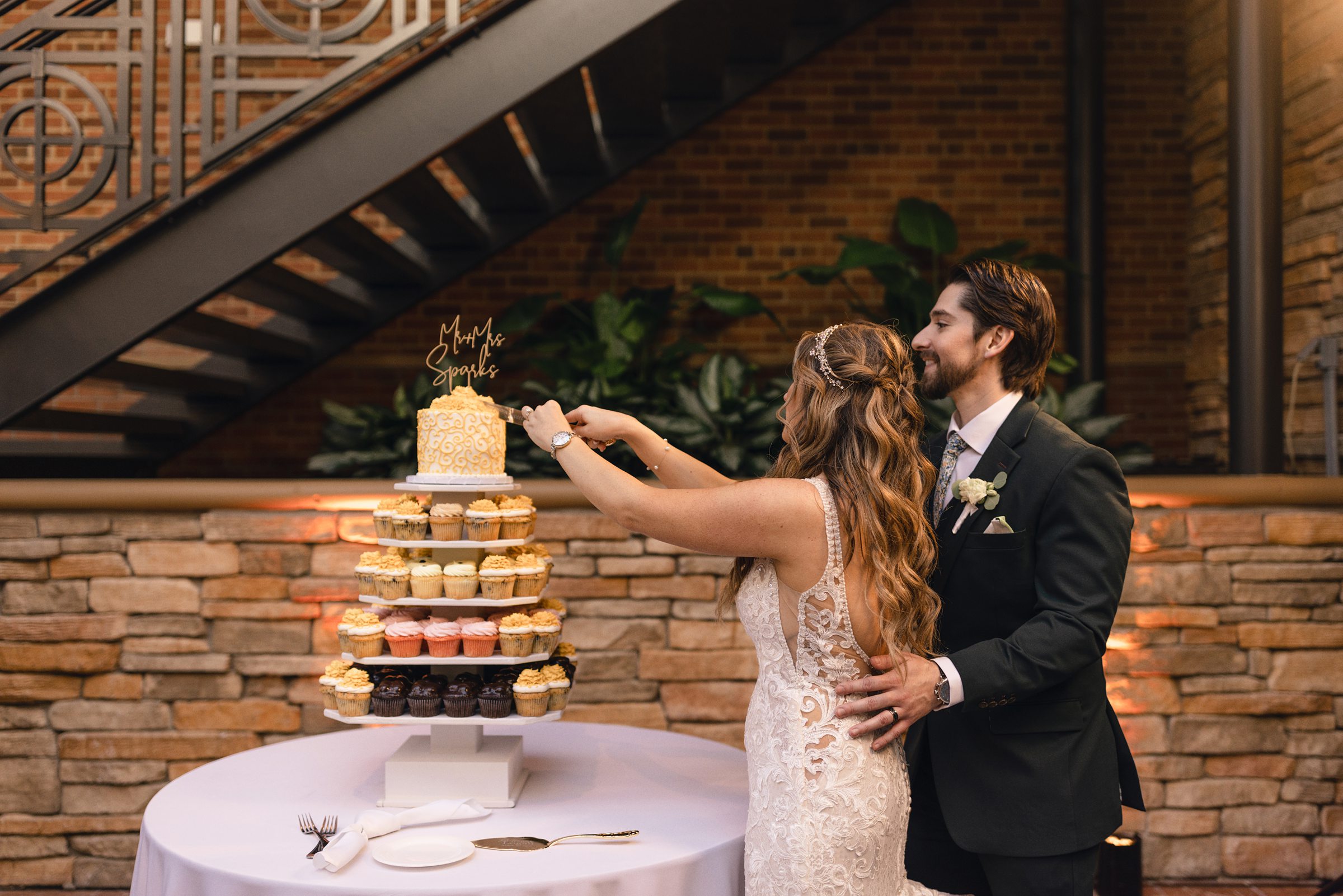 bride and groom cutting the cake at saint johns resort by Michele Maloney Photography