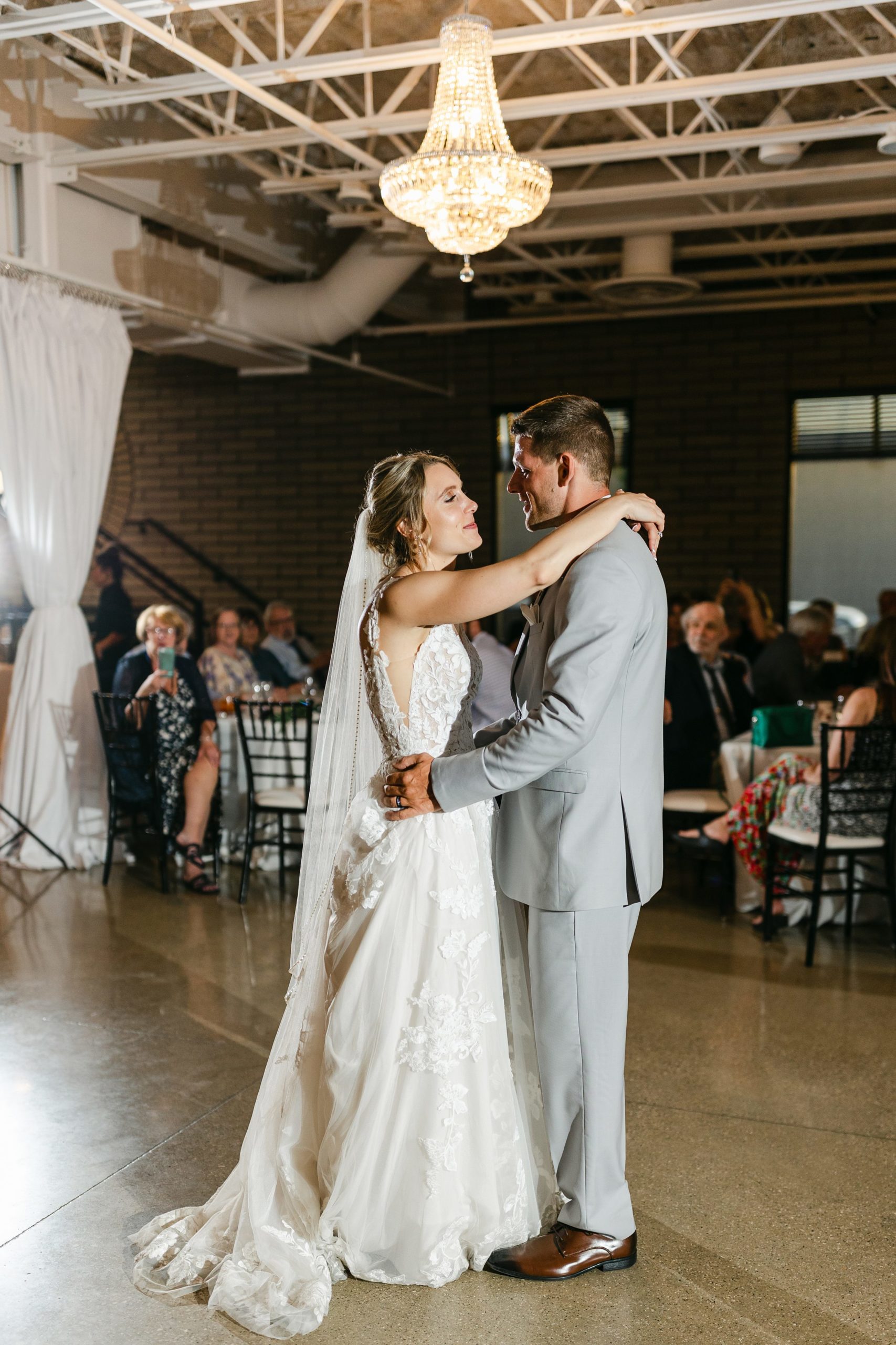 bride and groom's first dance at Port 393 in Holland Michigan by Michele Maloney Photography