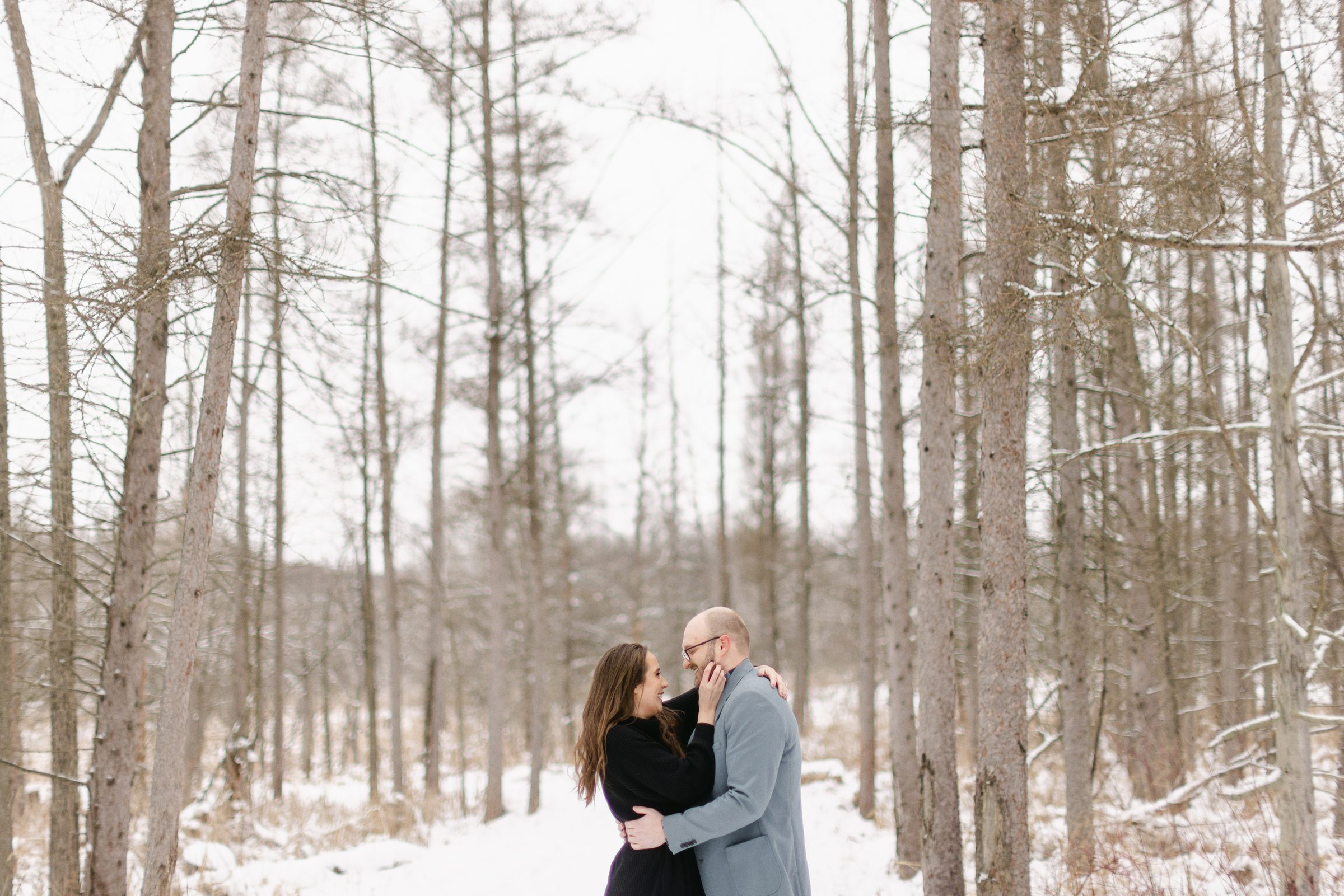 couple in the snow at Kensington Metro Park by Michele Maloney Photography