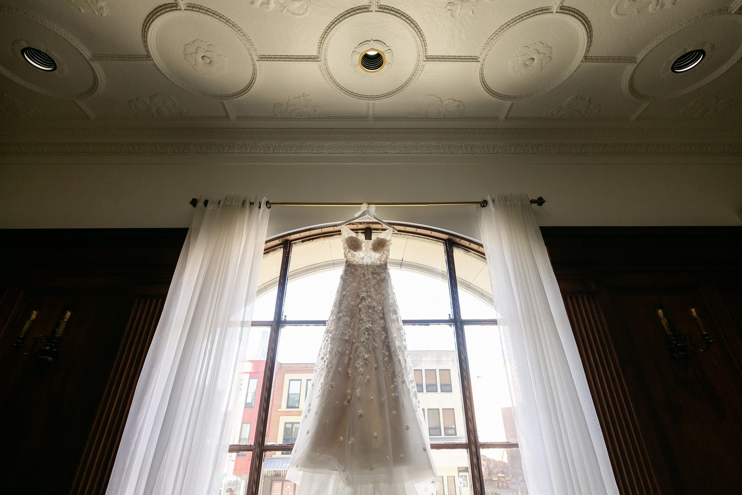 Bride's Dress in the window at the Treasury in Pontiac Michigan by Michele Maloney Photogpraphy