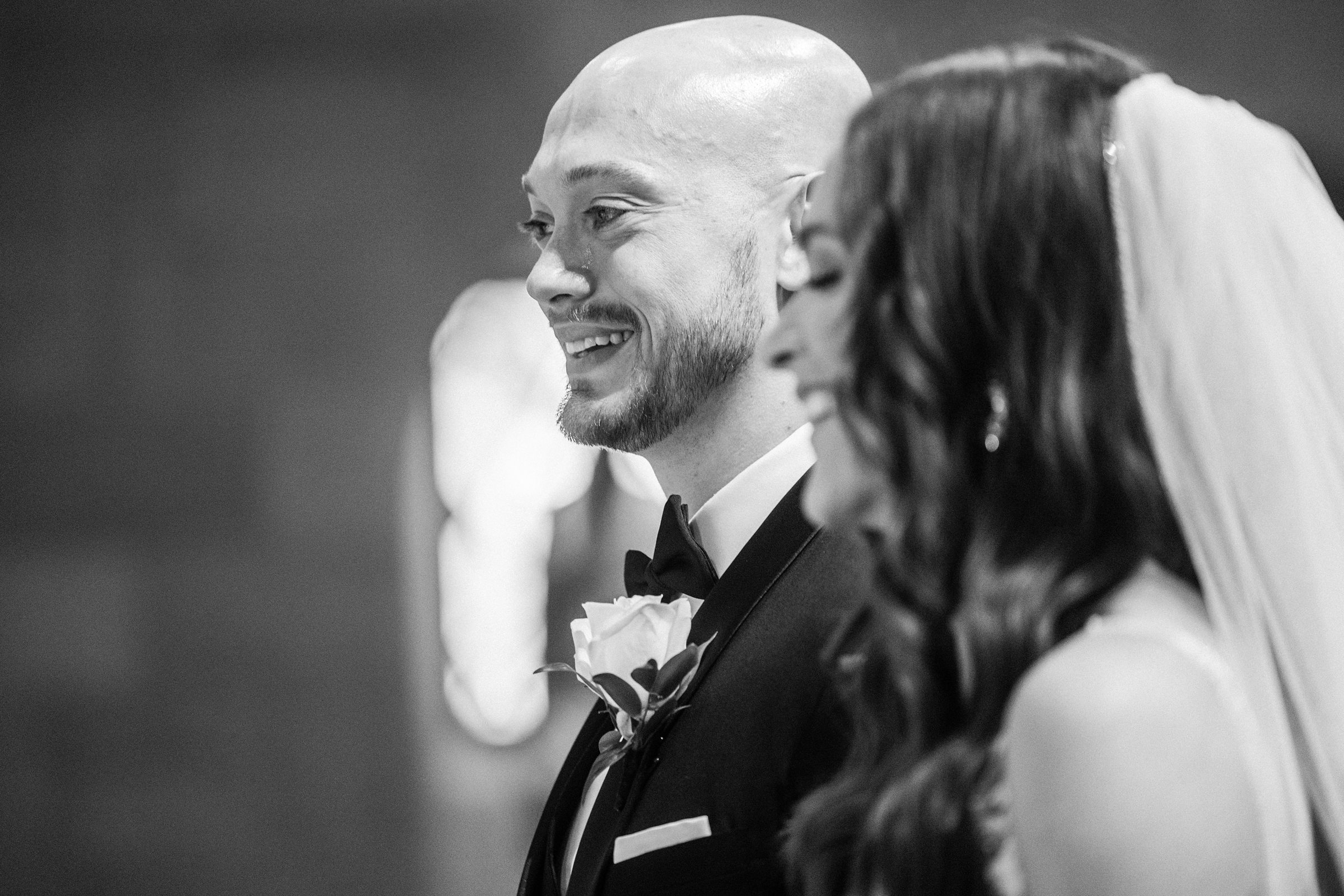 Groom crying at the altar at St. Hugo of the Hills by Michele Maloney Photography