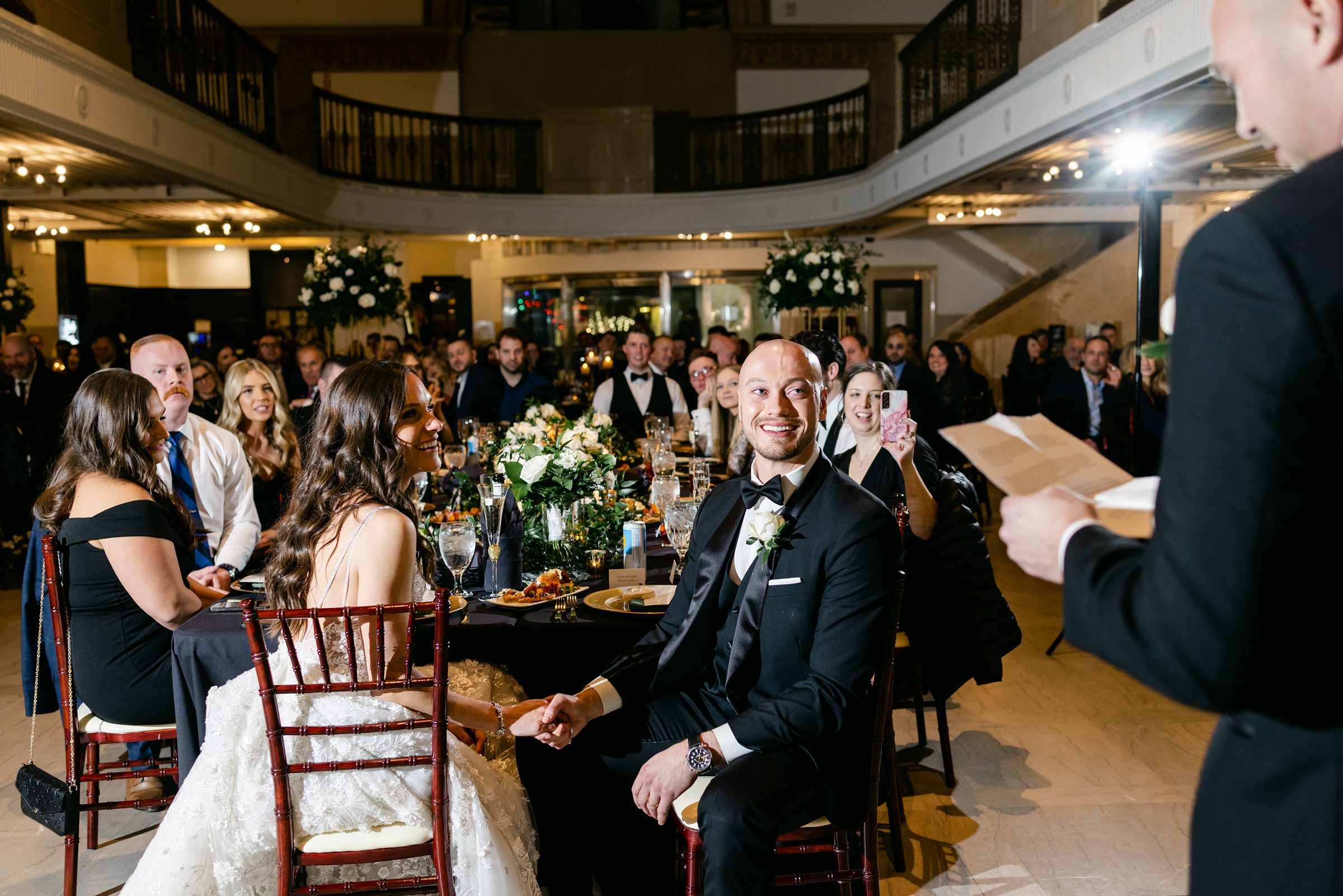 toasting the bride and groom during wedding reception at the Treasury in Pontiac Michigan by Michele Maloney Photogpraphy