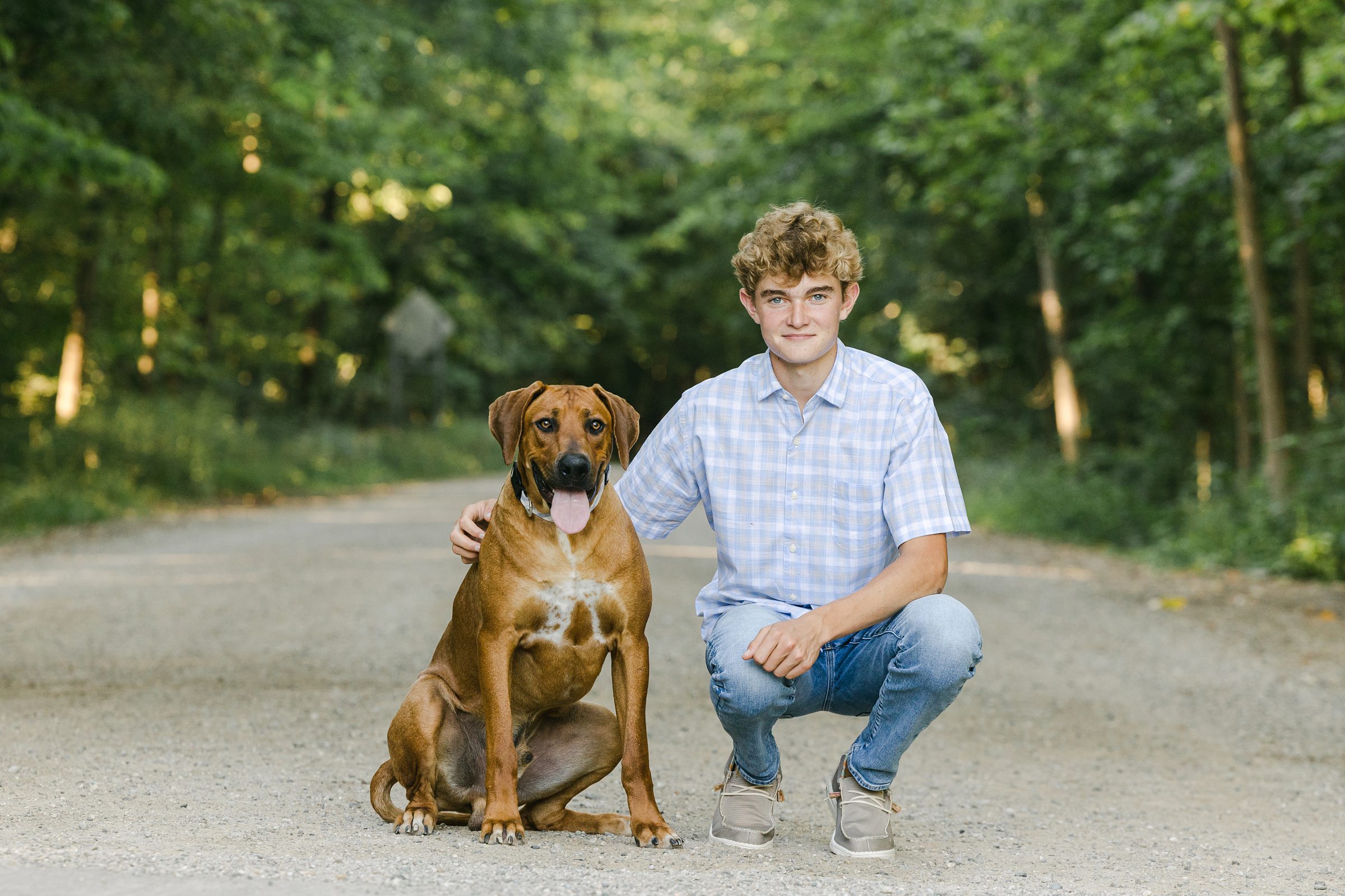 Senior Portrait of a boy and his dog in Grosse Ile Michigan by Michele Maloney Photography