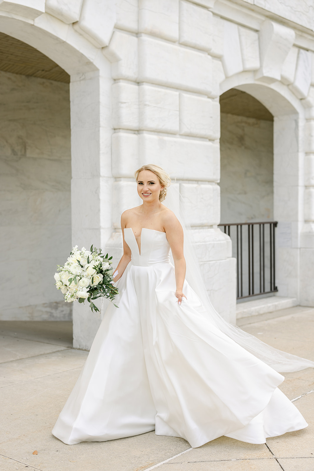 bride walking towards the camera for portraits during Dearborn Country Club wedding by Michele Maloney Photography