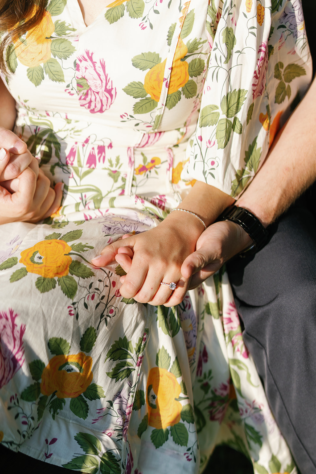 Close-up of Peter and Cecilia holding hands during their Addison Oaks engagement session.