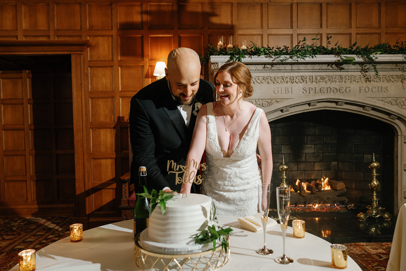 Aubrey and Alex cutting the cake at their June wedding at Gem Theatre.
