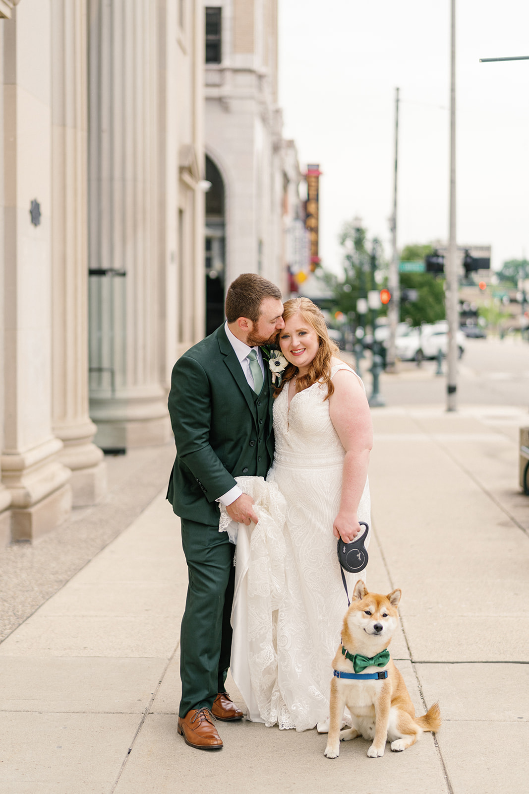 Bride and groom posing with their dog, Goku, at The Treasury on wedding day