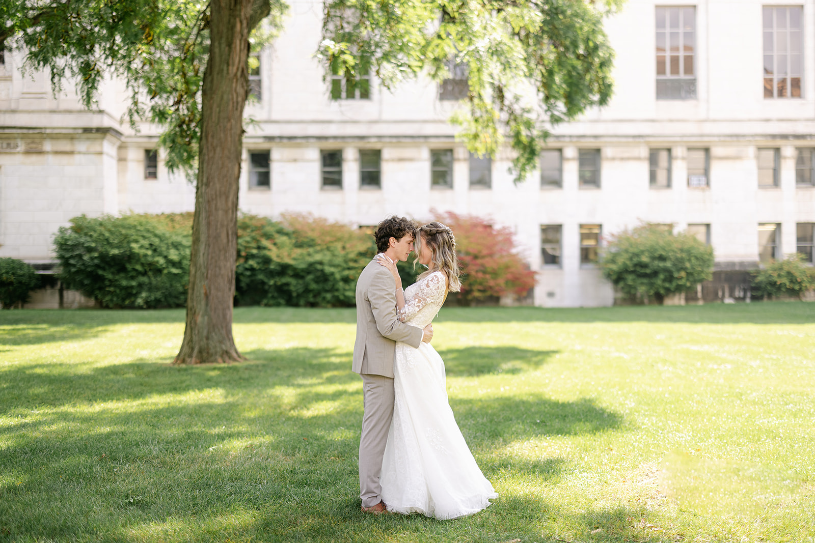 A sweet forehead-to-forehead moment surrounded by early fall colors.