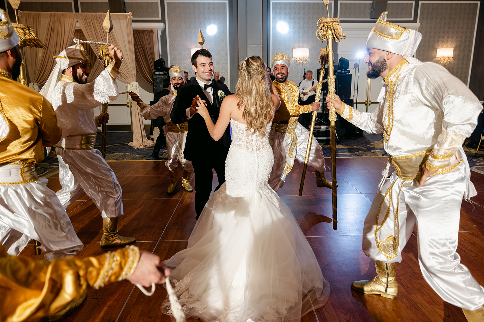 Alea and Kevin sharing a joyful moment during their fusion-wedding-at-the-dearborn-inn.