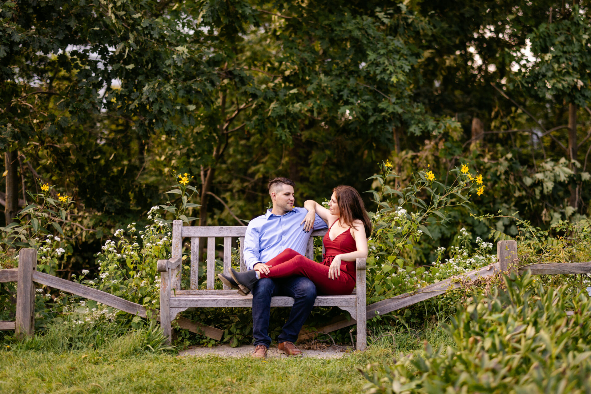 Sam & Niko sitting together on a bench during their Ann Arbor Arboretum session.