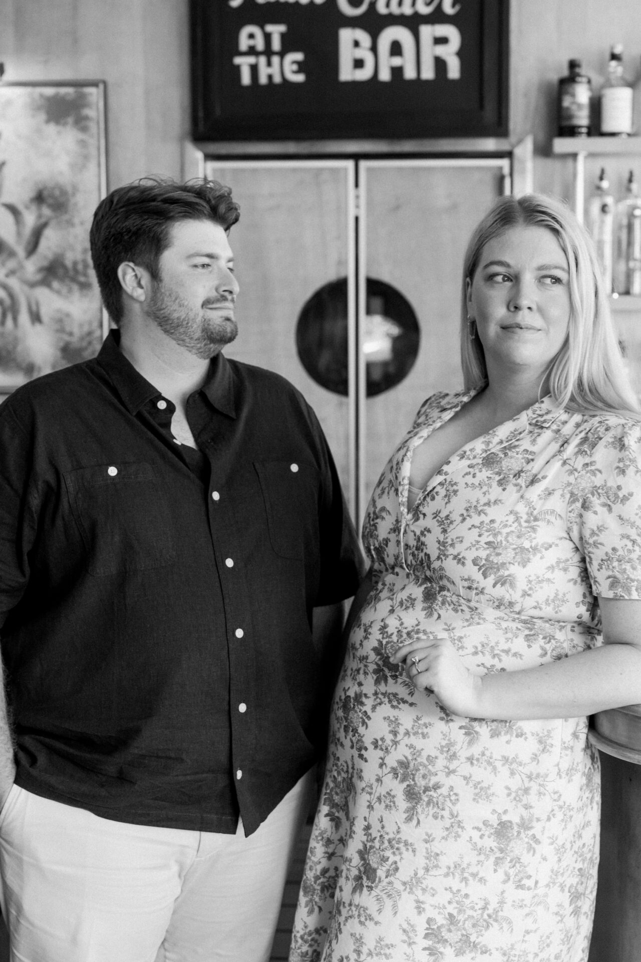 Couple cooling off inside Queen’s Bar in Detroit during their summer engagement session.
