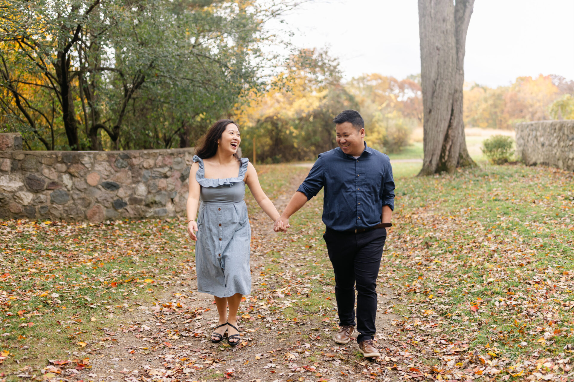 Sarah and Chong laughing together during their Fall Session at Stoney Creek.