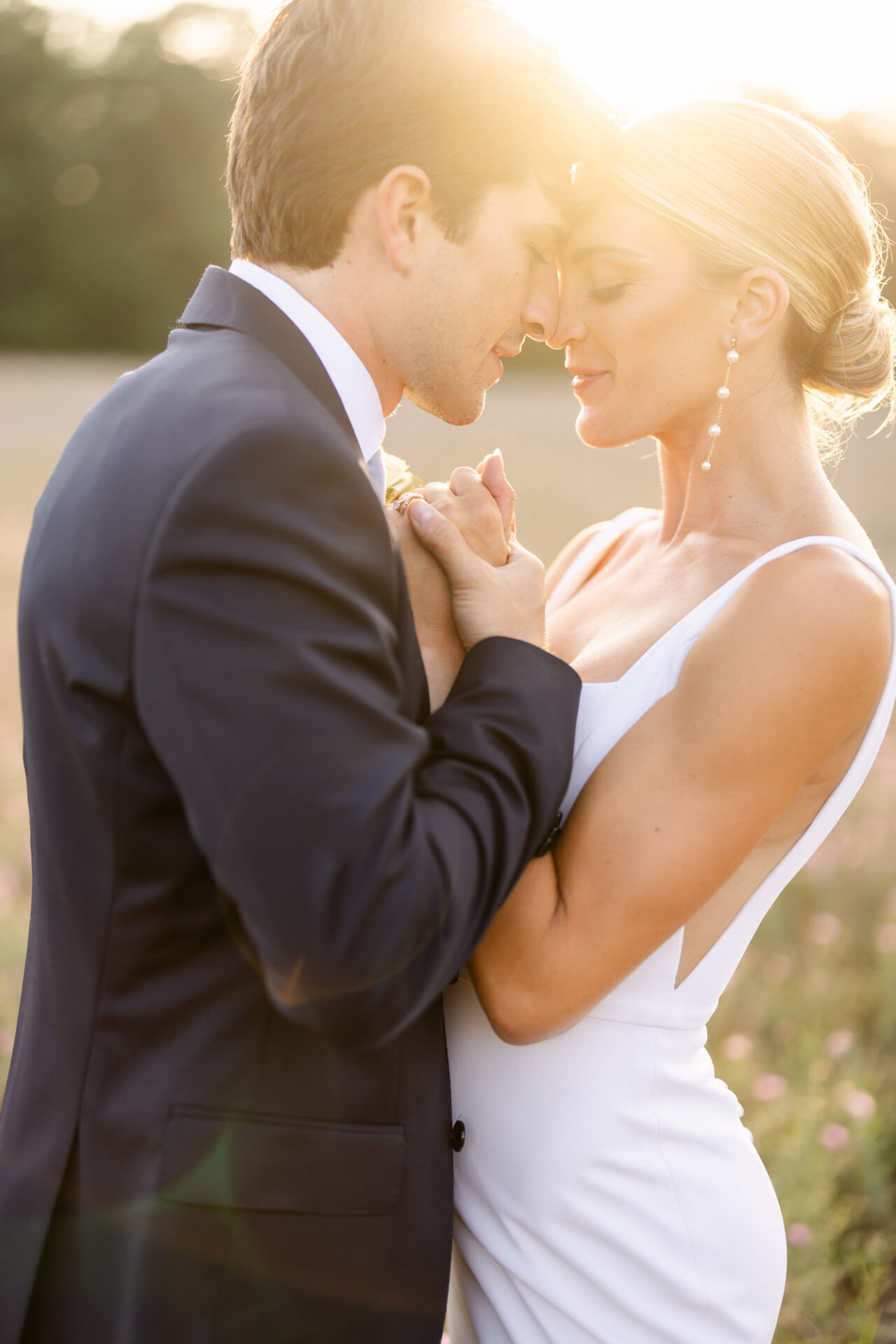 Golden hour portraits of Austin and Katy at the Summer Heritage Wedding Barns