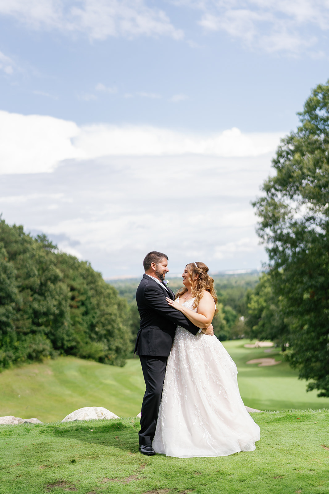Bride and groom sharing a quiet moment during their Summer Pine Knob Carriage House Wedding
