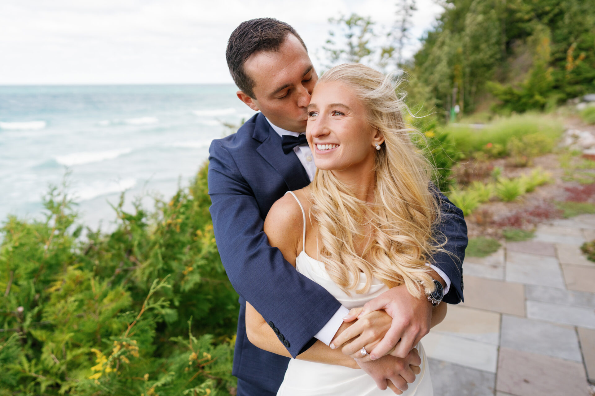 Bride and groom sharing a quiet moment during their Leland Michigan Wedding at a private lakeside residence.
